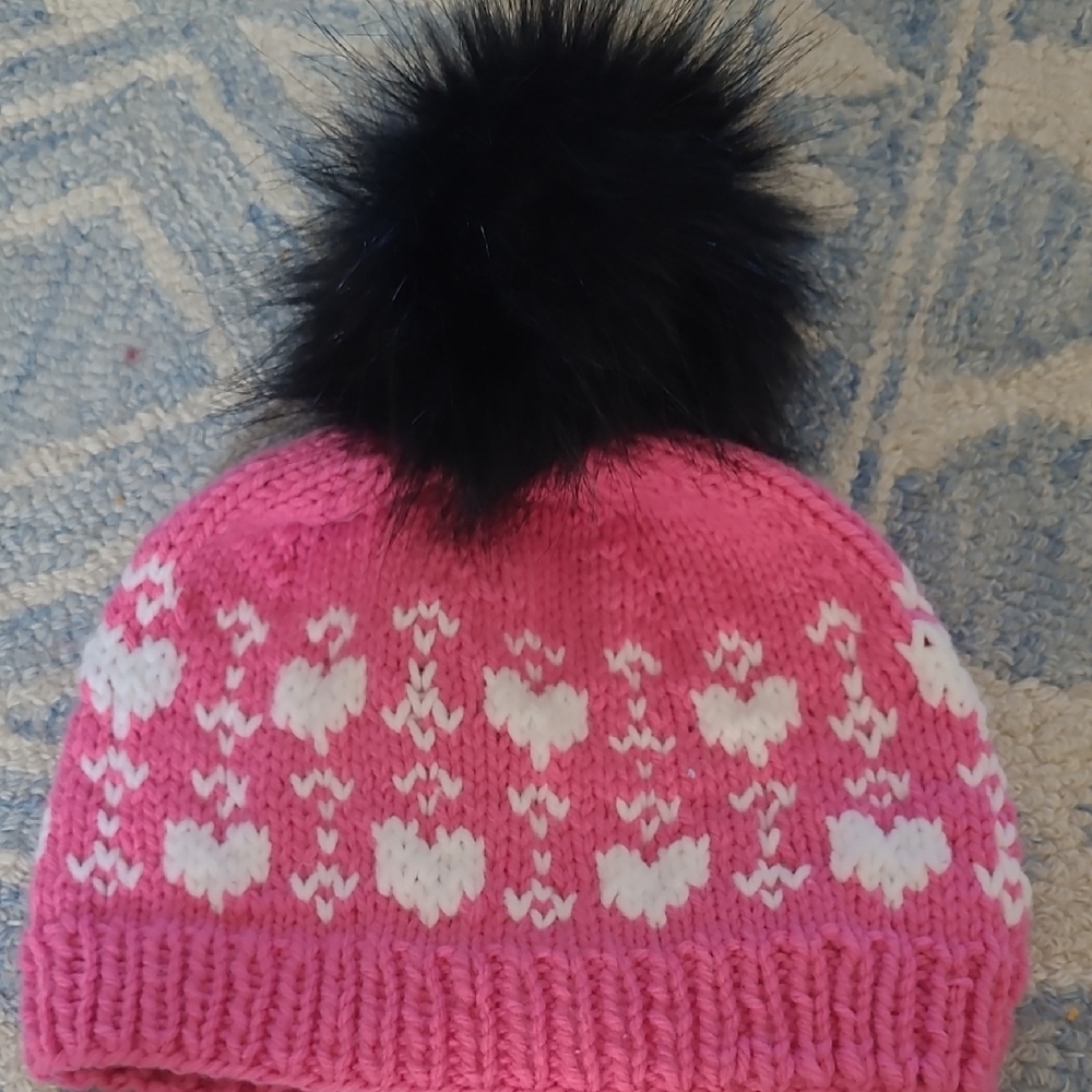 Pink and White Winter Hat with Decorative Pattern